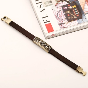 Vintage brown leather skull bracelet with antique bronze alloy buckle and punk charms