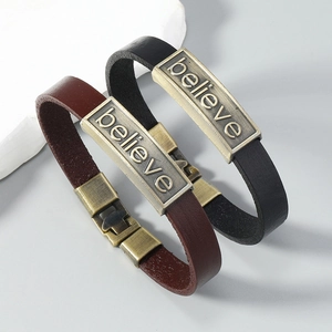 Retro leather bracelets in black and brown featuring a bronze Believe engraved metal plate