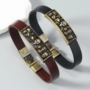 Retro punk leather bracelet featuring a vintage skull metal plaque and secure buckle