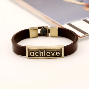 Retro brown leather bracelet with an antique bronze metal plate engraved with achieve