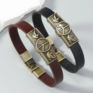 Vintage leather peace symbol bracelets in black and brown with dove metal charms