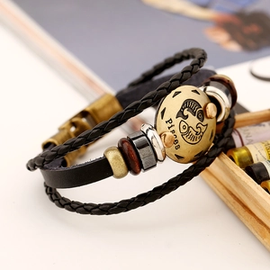 Handcrafted Pisces zodiac leather bracelet with braided straps and vintage metal charm