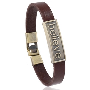 Retro brown leather bracelet with bronze 'believe' lettering on metal plaque