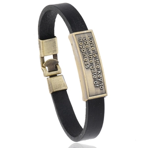 Vintage black leather bracelet with bronze metal plate engraved with inspirational quote
