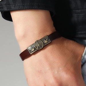 Retro brown leather bracelet with bronze peace sign and dove emblem for men and women