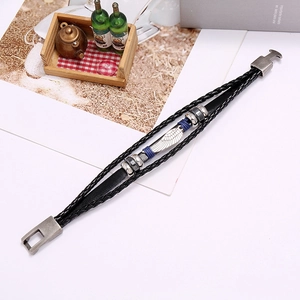 Multilayer leather bracelet with silver wing feather charm and braided rope texture