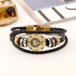 Detail of multi-layer leather Leo zodiac bracelet with bronze lion emblem and cord