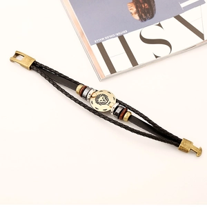 Braided leather Leo zodiac bracelet with vintage lion head metal charm and wooden beads