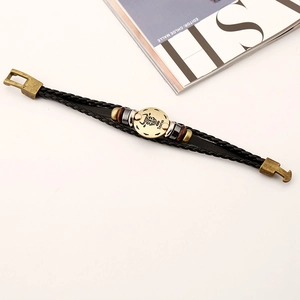 Bracelet en cuir tressé avec signe du zodiaque Taureau et breloque en bronze antique