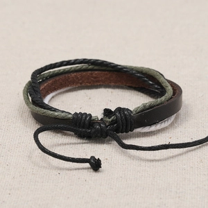 Multilayer retro woven leather bracelet with adjustable cords in brown and green tones