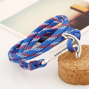 Detailed close-up of woven nautical anchor bracelet with engraved HOPE metal clasp