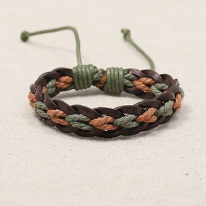 Close-up of handmade woven cowhide leather bracelet with adjustable drawstrings
