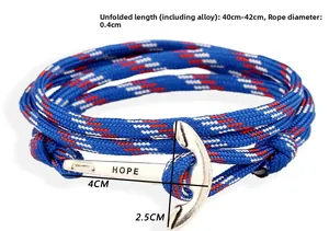 Macro shot of a braided nylon nautical bracelet with silver anchor buckle featuring HOPE text