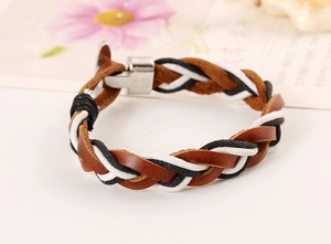 Detail of tricolor braided leather bracelet with a polished silver metallic buckle clasp