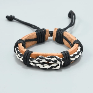 Detail of handmade multi-layer braided leather bracelet with adjustable cord closure