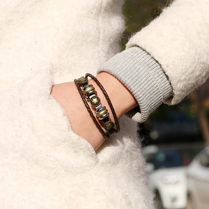 Retro punk braided leather bracelet featuring vintage star charms and bronze alloy accents
