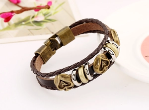 Detailed close-up of dark brown braided leather bracelet with heart letter A pendants