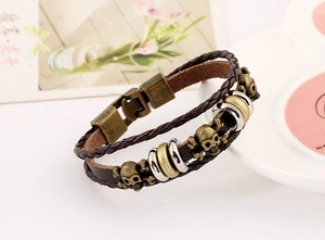 Vintage punk leather bracelet with bronze skull charms and multi-layer woven straps