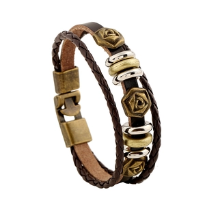 Retro multi-layer brown leather bracelet with carved rose metal charms and braided ropes