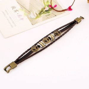 Retro multi-layer woven leather bracelet featuring bronze peace sign charms and clasp