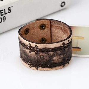 Punk vintage wide leather bracelet with embossed wire pattern and bronze snap buttons