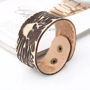 Vintage wide leather skull bracelet for men with embossed pattern and bronze snaps