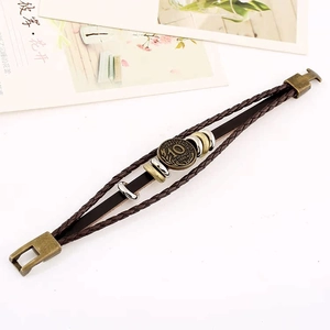 Vintage braided leather multilayer bracelet with antique bronze coin charm and metal rings