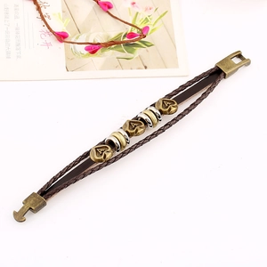 Retro multi-layer woven leather bracelet featuring bronze heart charms and metal rings