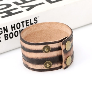 Vintage punk wide brown leather bracelet with striped texture and bronze snap buttons
