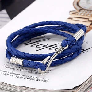 Close-up of royal blue multi-layer braided leather bracelet with silver fish hook clasp