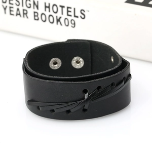 Punk wide black braided leather bracelet with dual metal snap buttons on a white background