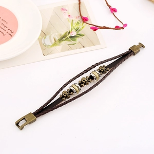 Punk vintage multi-layer brown leather bracelet with bronze skull charms and metal buckle