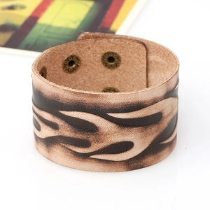 Vintage light brown leather cuff bracelet with dark flame patterns and bronze snaps