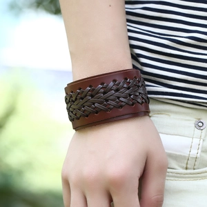 Men's retro wide woven genuine leather bracelet in dark brown finish on wrist