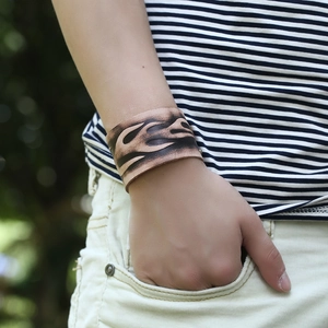 Vintage wide leather bracelet with black flame pattern for men, rugged retro biker style