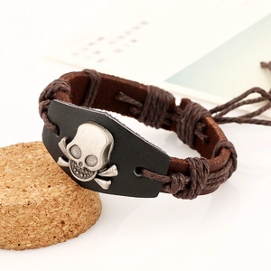 Detail of vintage skull leather bracelet with hand-woven hemp rope and adjustable straps