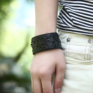 Retro multi-layer wide leather wristband with woven lace-up design in a biker rock style