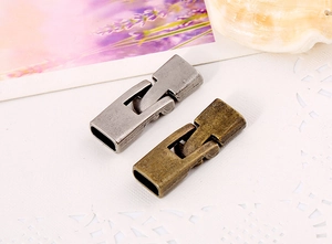 Detail of vintage bronze and silver rectangular clasps for DIY leather cord bracelets
