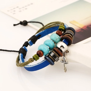 Handmade multilayer leather bead bracelet with a cross charm and turquoise accents