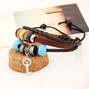 Handmade multilayer leather bracelet featuring ceramic beads and a vintage key pendant