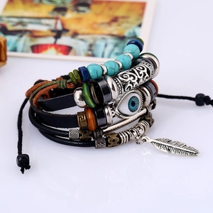 Multilayer bohemian beaded leather bracelet with blue evil eye and metal feather pendant