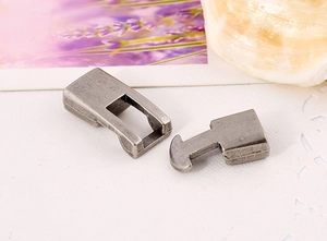 Macro detail of antique silver toggle clasps for handmade bracelets and leather crafts
