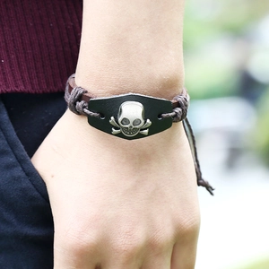 Handmade leather punk bracelet featuring a vintage alloy skull and crossbones emblem