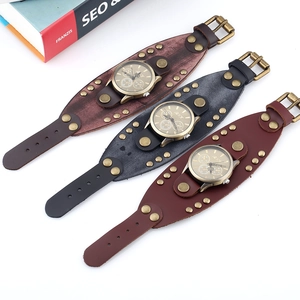 Macro view of retro punk leather watches with metal rivets and BNK branding details