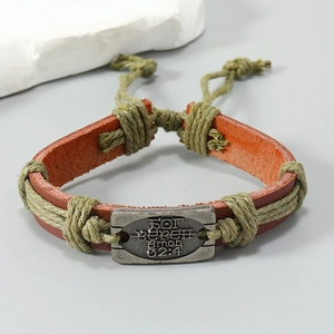 Handmade vintage brown leather bracelet with woven green rope and engraved metal plaque