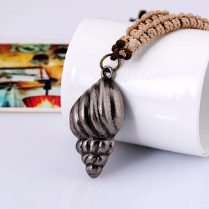Vintage seashell pendant on handmade braided leather cord necklace for men
