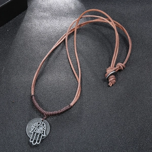 Vintage woven leather cord necklace with a metallic Hand of Fatima pendant for men