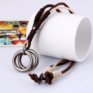 Punk vintage brown leather cord necklace for men featuring a metallic double ring pendant