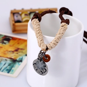 Retro punk braided leather necklace with metal flower pendant and wooden bead detail