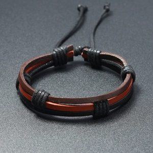 Detail of multi-layer handmade braided leather bracelet with adjustable cord knot